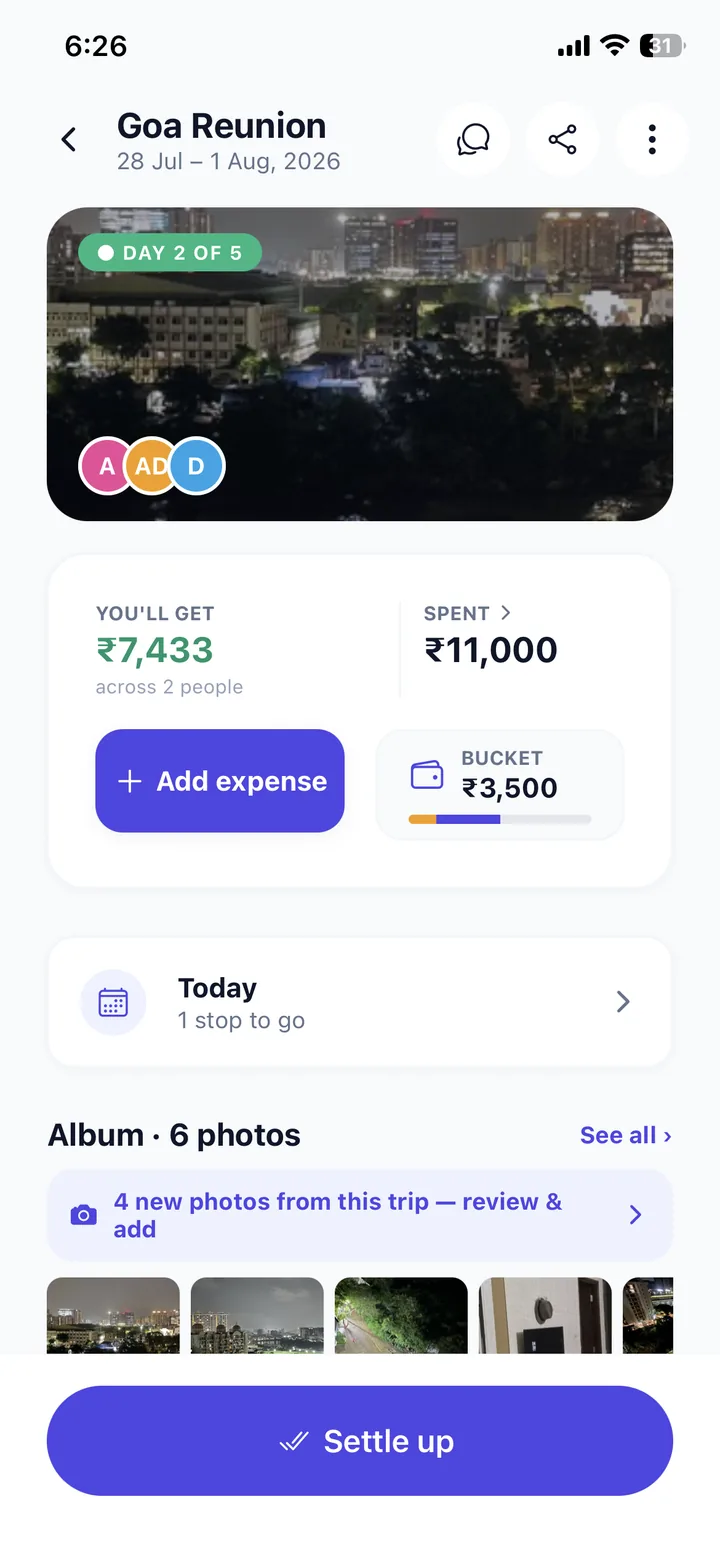 A TripSynk trip screen showing spend so far, the shared album and a settle-up button